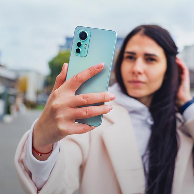 A girl with a smartphone making selfie